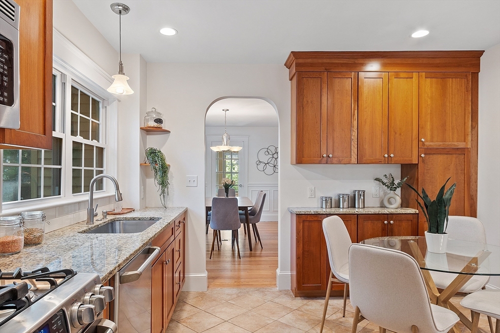 15 Marion Road Watertown, MA 02472 - Photo 17 of 41 a kitchen with a table chairs sink and cabinets