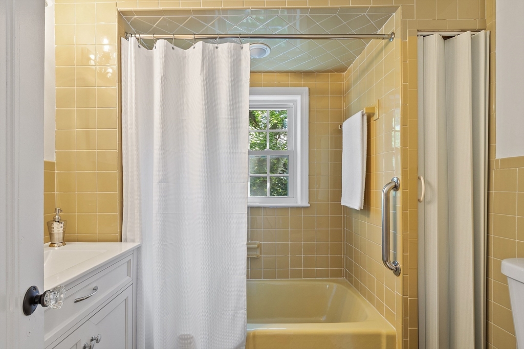 15 Marion Road Watertown, MA 02472 - Photo 20 of 41 a bathroom with a shower and a sink