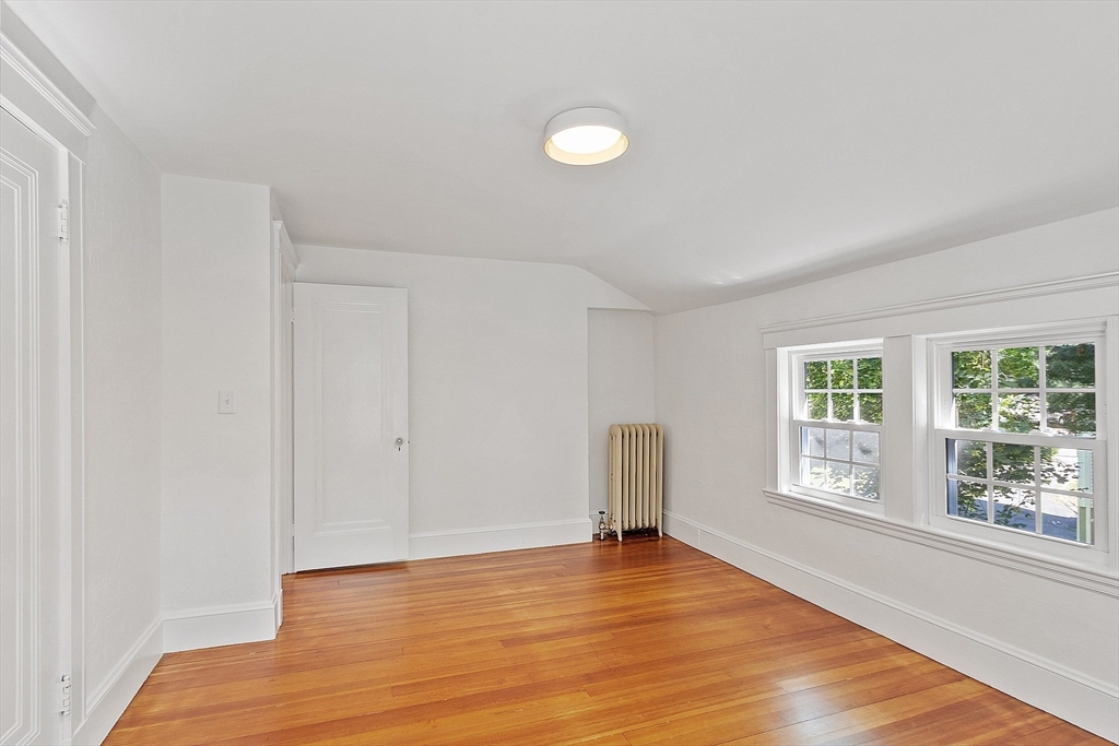 15 Marion Road Watertown, MA 02472 - Photo 21 of 41 a view of empty room with wooden floor and fan