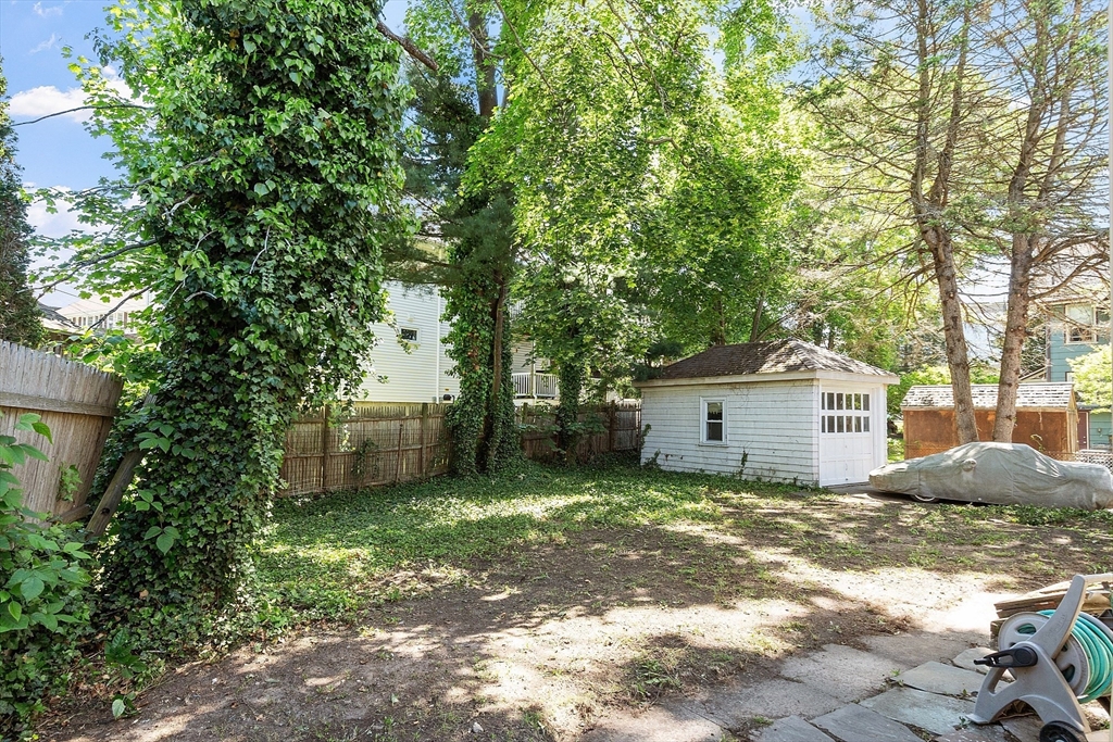 15 Marion Road Watertown, MA 02472 - Photo 38 of 41 a view of a house with a large tree and a yard