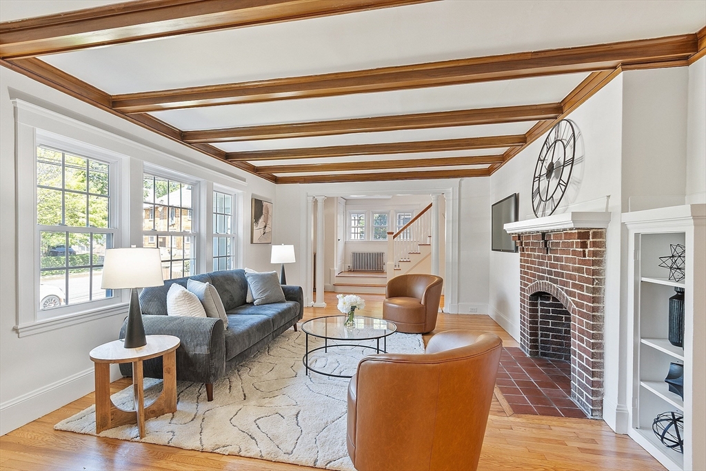 15 Marion Road Watertown, MA 02472 - Photo 5 of 41 a living room with fireplace furniture and a large window
