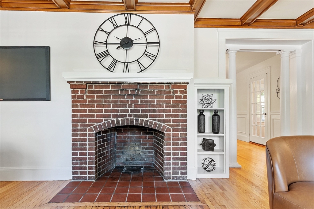 15 Marion Road Watertown, MA 02472 - Photo 6 of 41 a living room with a fireplace and a rug