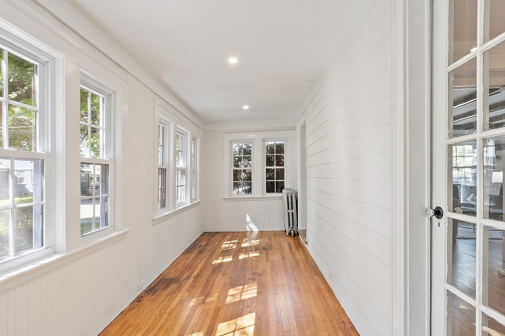 15 Marion Road Watertown, MA 02472 - Photo 8 of 41 a view of a hallway with wooden floor and staircase