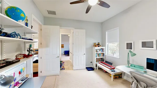 an aerial view of a house with outdoor space and swimming pool