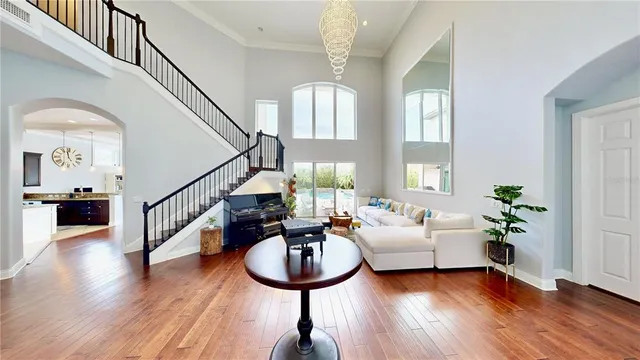 a living room with patio furniture and a fireplace