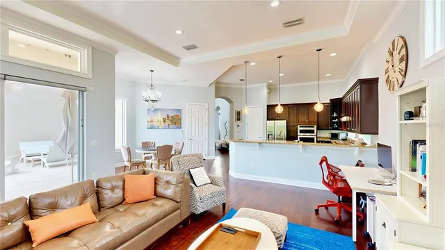 a kitchen with stainless steel appliances granite countertop a sink refrigerator and cabinets