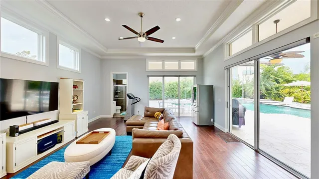 a view of a dining room with furniture wooden floor and chandelier