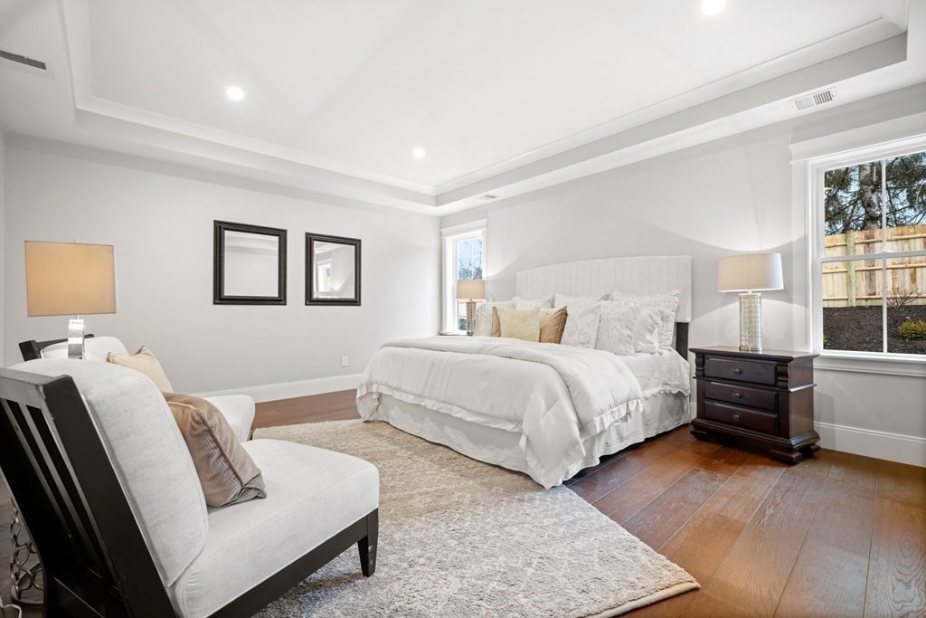 5 Wayside Road Natick, MA 01760 - Photo 11 of 29 a bedroom with a bed and wooden floor