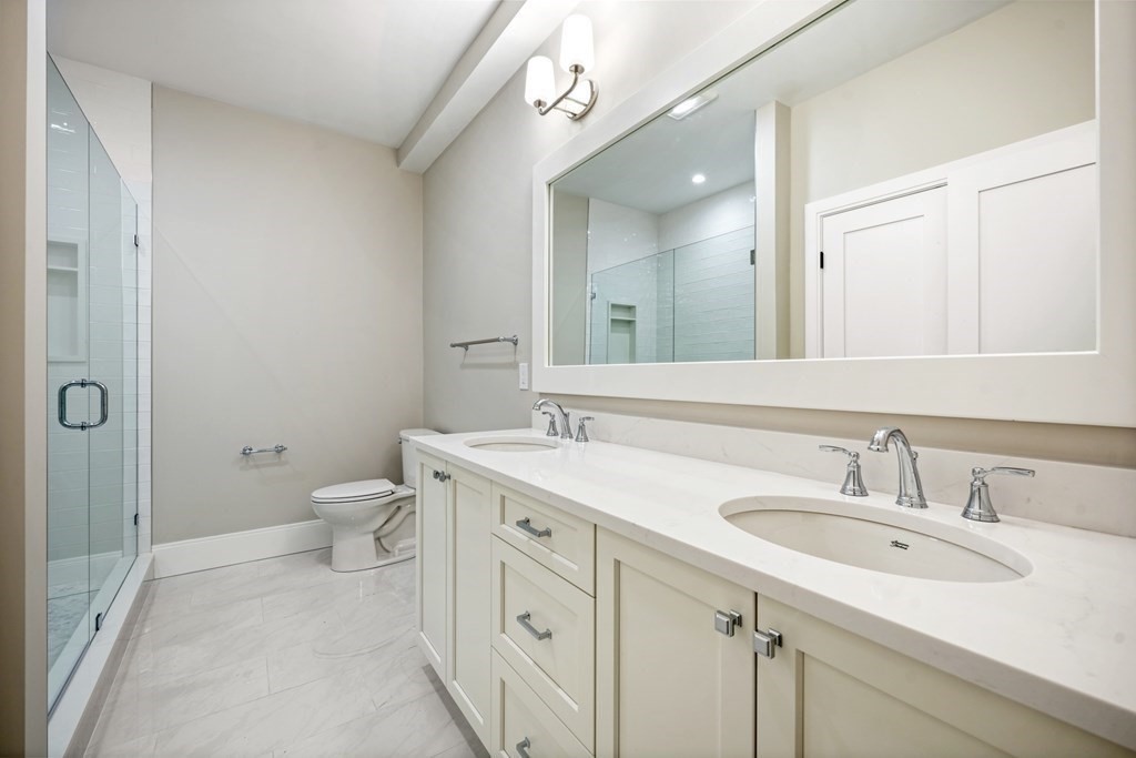 5 Wayside Road Natick, MA 01760 - Photo 15 of 29 a bathroom with a sink a toilet and shower