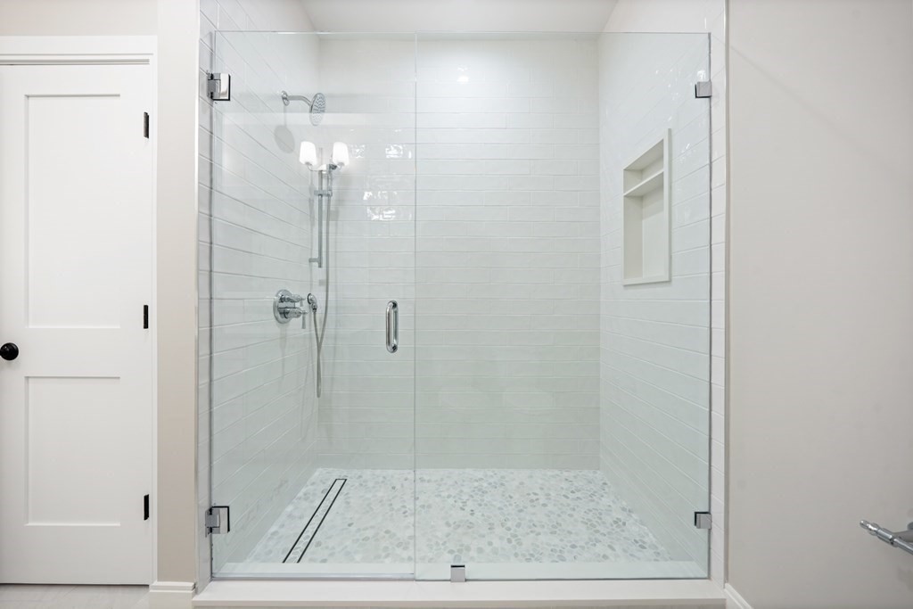 5 Wayside Road Natick, MA 01760 - Photo 17 of 29 a bathroom with a glass shower door