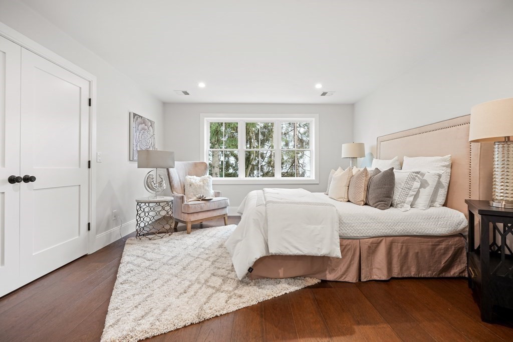 5 Wayside Road Natick, MA 01760 - Photo 21 of 29 a bedroom with a bed and wooden floor