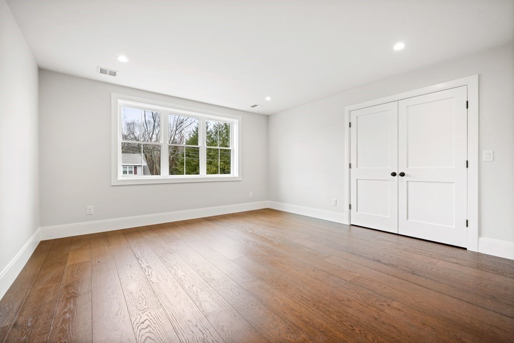 5 Wayside Road Natick, MA 01760 - Photo 24 of 29 an empty room with wooden floor and windows