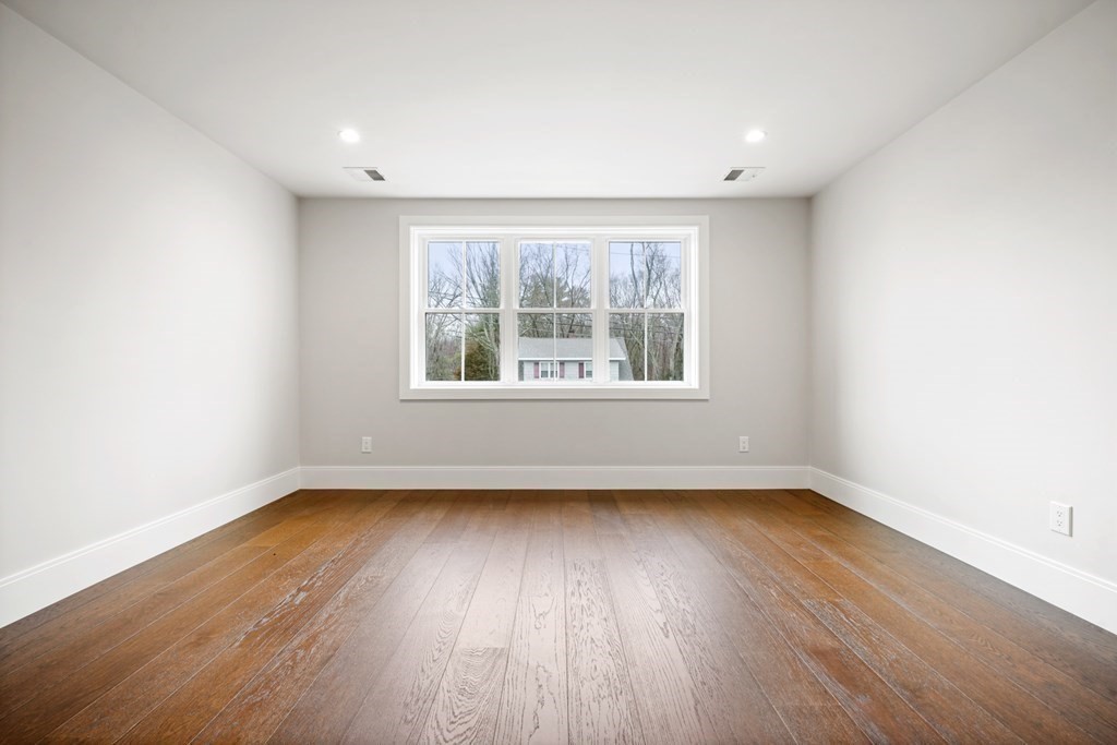5 Wayside Road Natick, MA 01760 - Photo 25 of 29 an empty room with wooden floor and windows