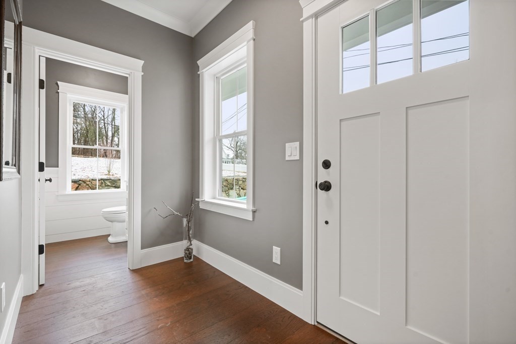 5 Wayside Road Natick, MA 01760 - Photo 27 of 29 a view of an empty room with a window and wooden floor