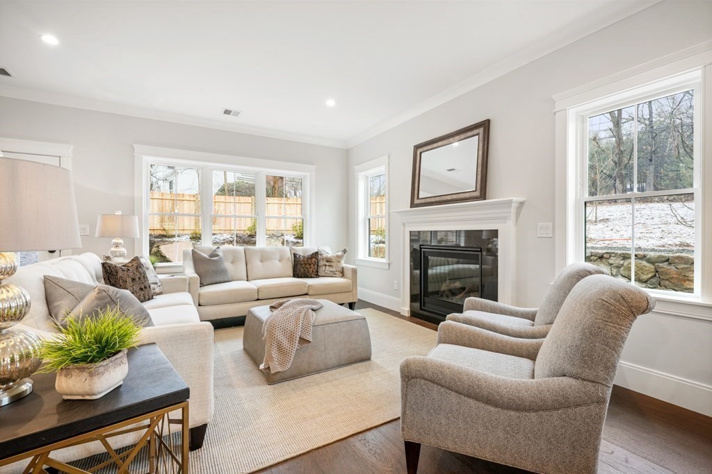 5 Wayside Road Natick, MA 01760 - Photo 8 of 29 a living room with furniture fireplace and a large window