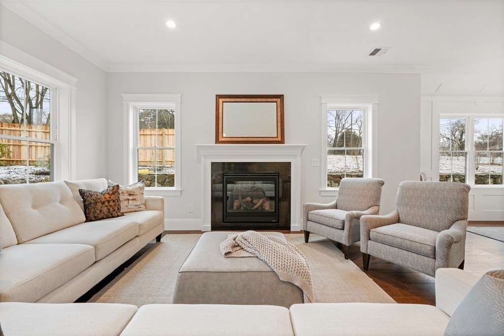 5 Wayside Road Natick, MA 01760 - Photo 9 of 29 a living room with furniture and a fireplace