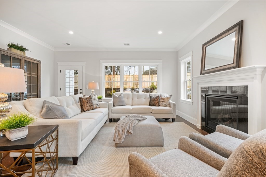 5 Wayside Road Natick, MA 01760 - Photo 10 of 29 a living room with furniture fireplace and a large window