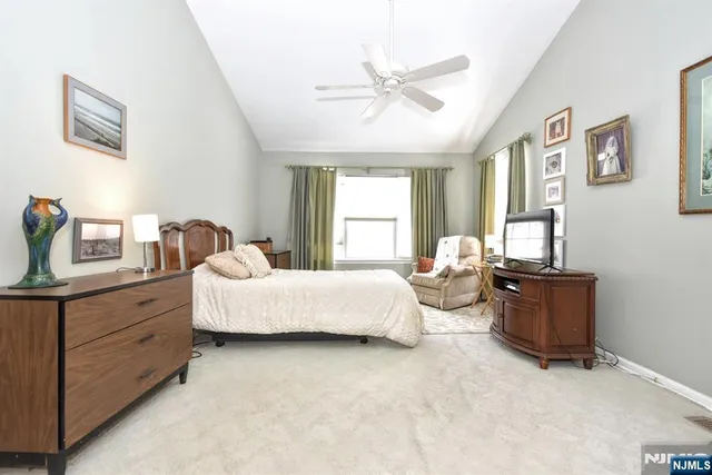 a spacious bathroom with a granite countertop sink mirror and a