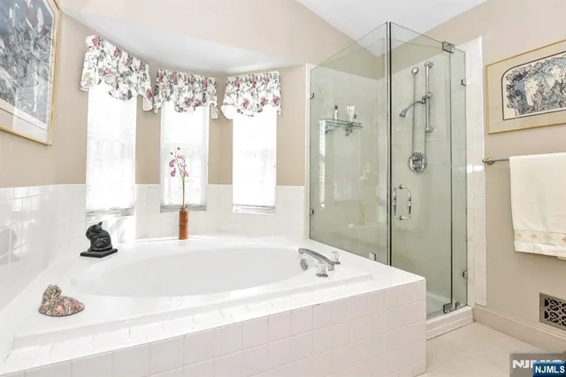 a bathroom with a granite countertop sink a toilet and a mirror