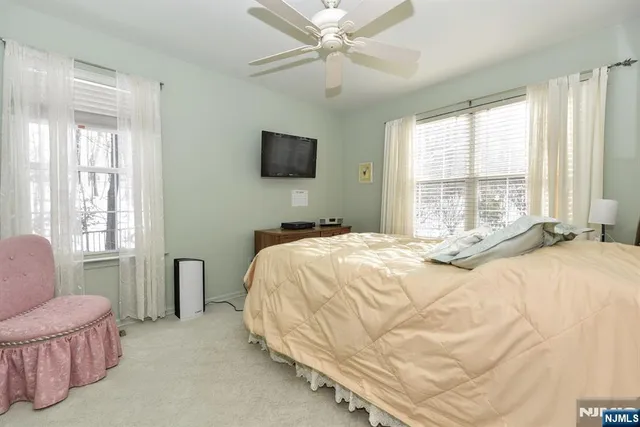 a view of a workspace with a window and lounge chair