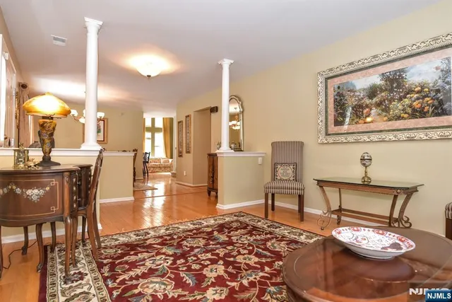 a view of a dining room with furniture and a chandelier