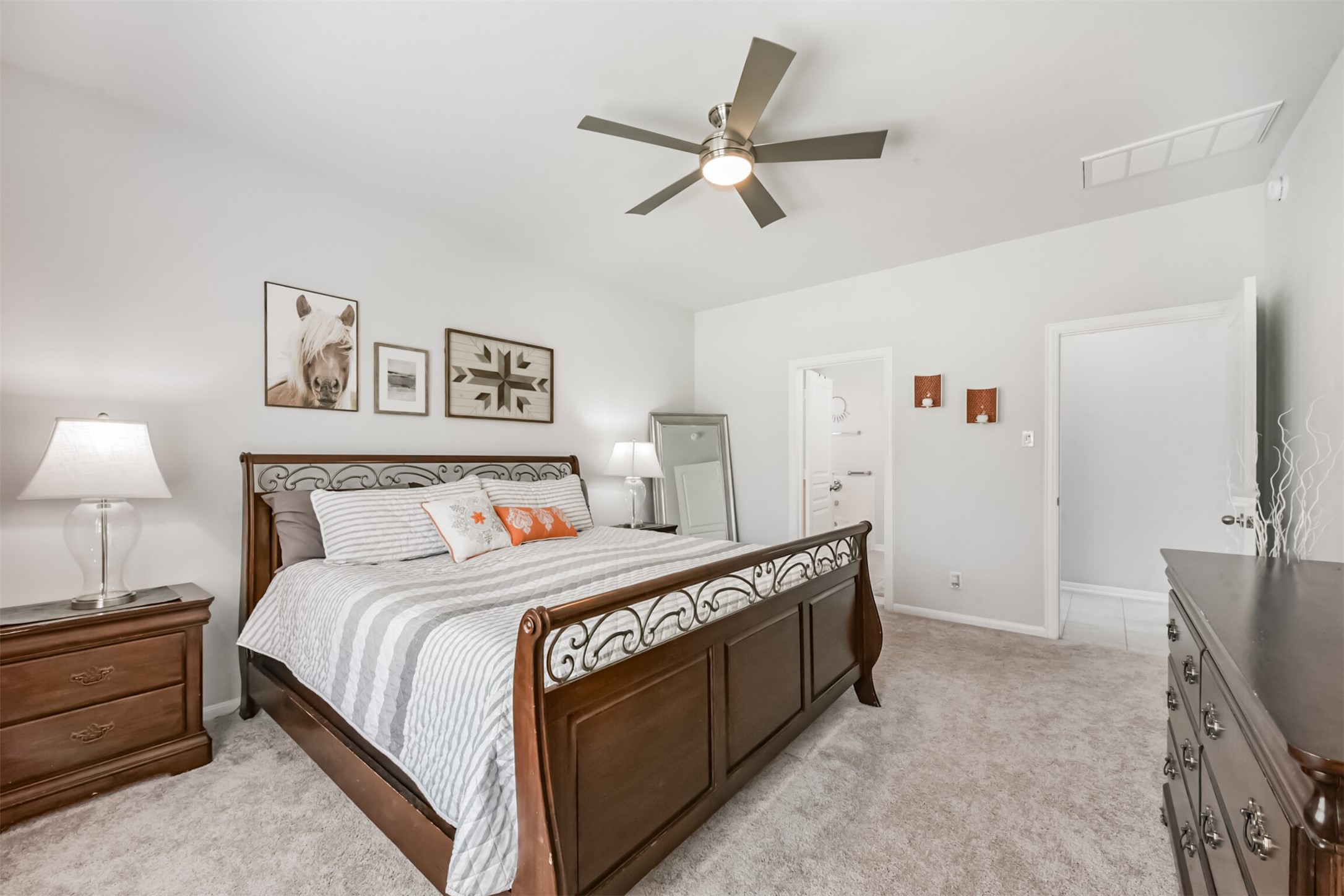 10018 Chase Court Baytown, TX 77521 - Photo 20 of 46 a bedroom with a bed and a ceiling fan