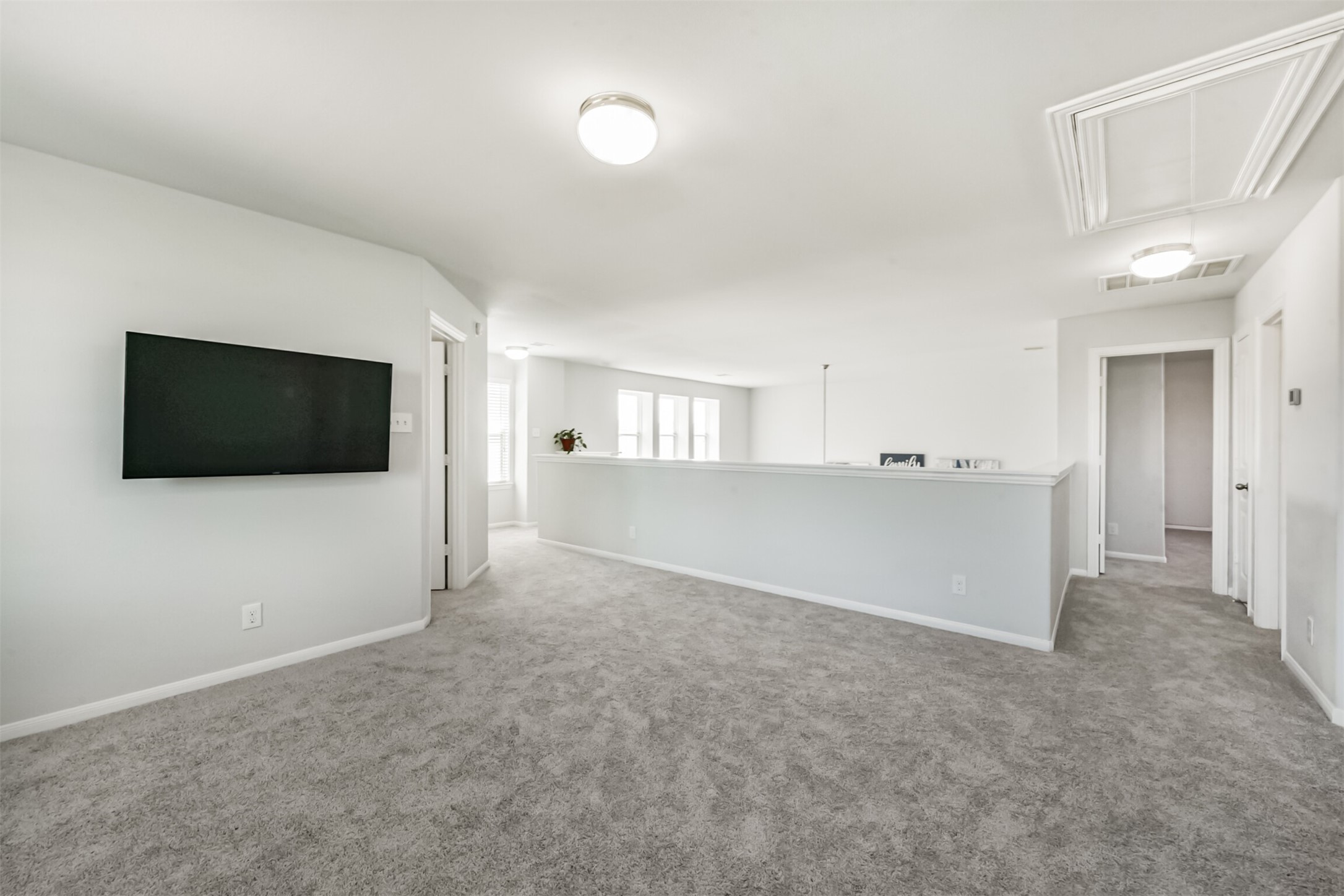 10018 Chase Court Baytown, TX 77521 - Photo 27 of 46 a view of a livingroom with an empty space and a kitchen