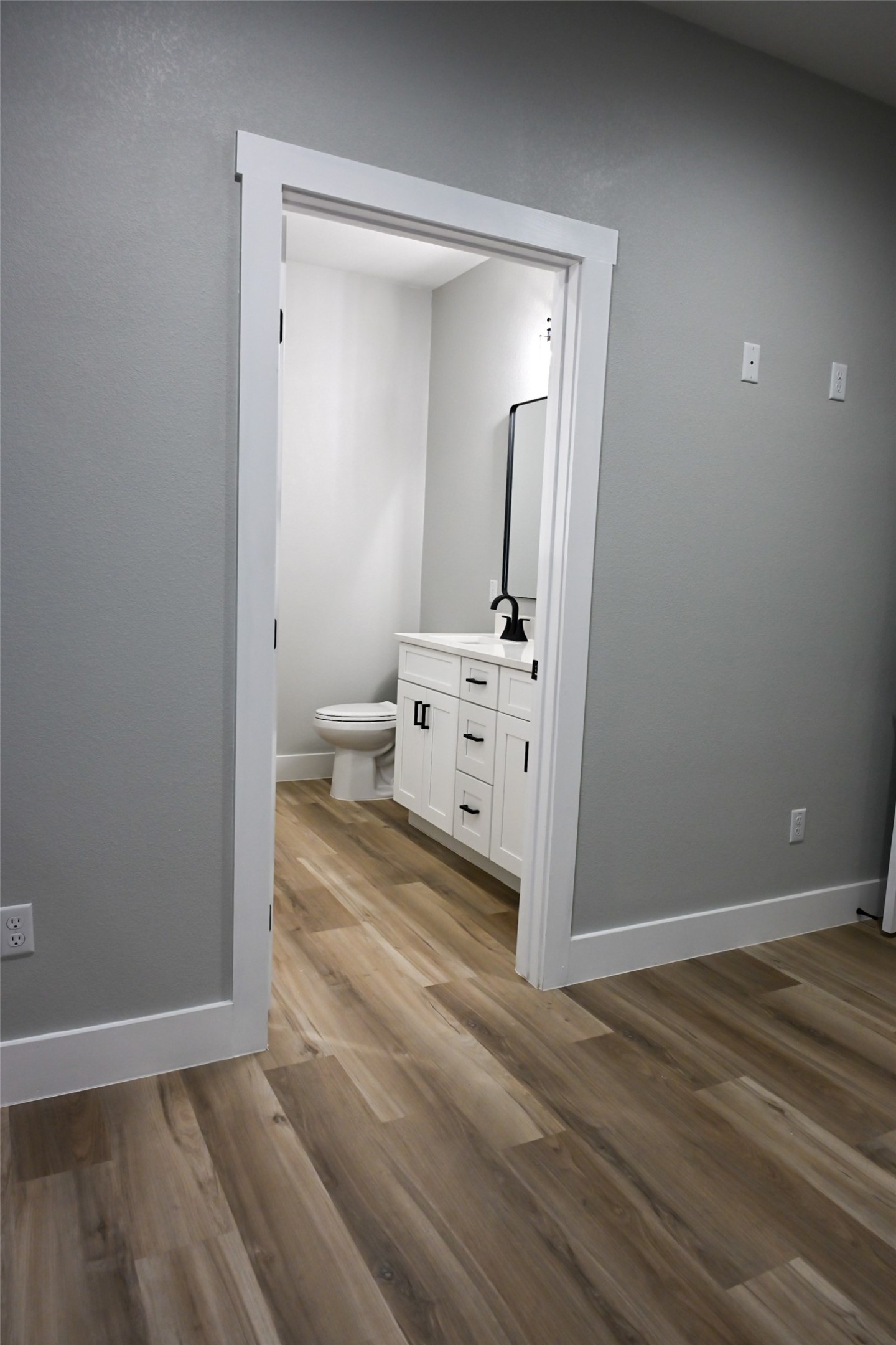 516 North Hackberry Avenue Luling, TX 78648 - Photo 15 of 36 Bathroom with vanity and light wood-type flooring