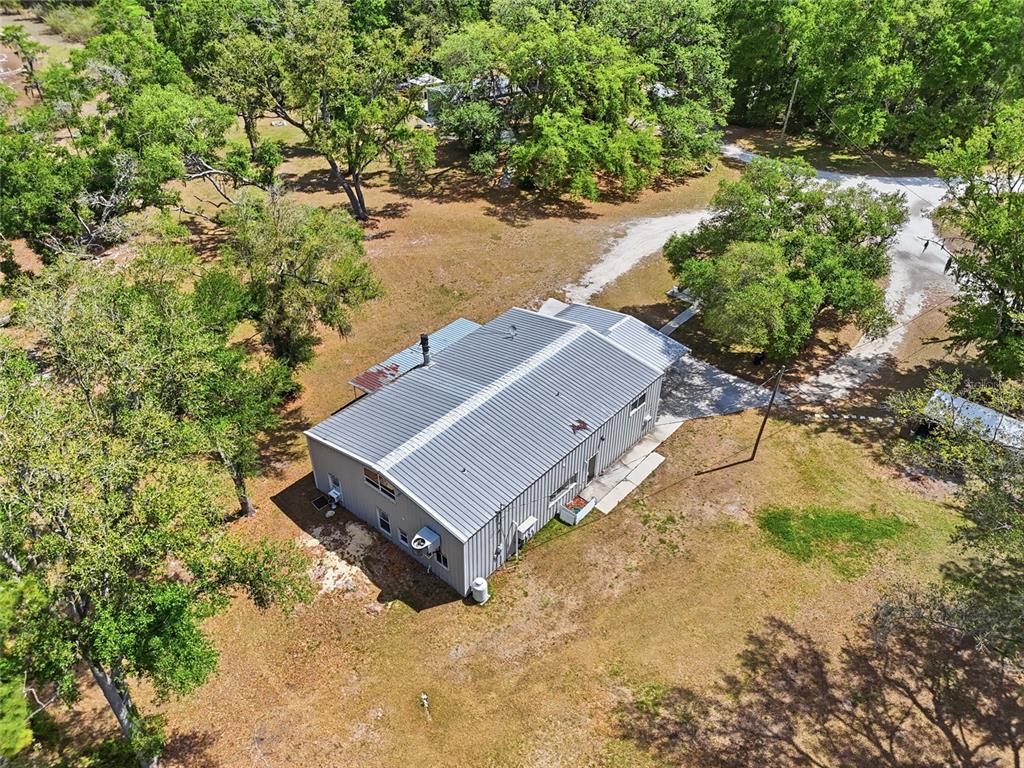 401 Southeast Falcon Road Branford, FL 32008 - Photo 17 of 76 an aerial view of a house with a yard and lake view