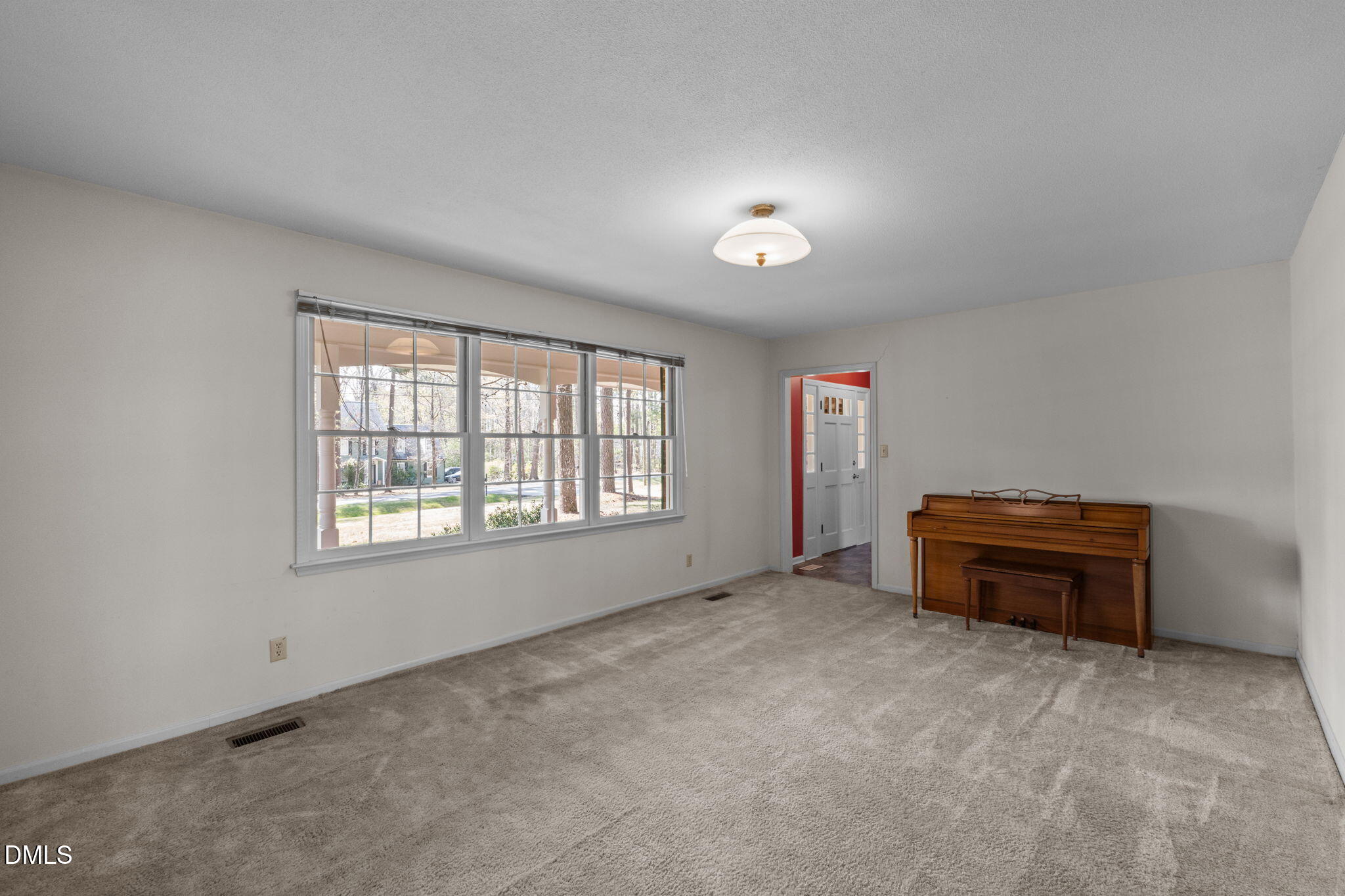 2421 Bonnie Brae Road Durham, NC 27703 - Photo 11 of 55 an empty room with furniture and windows
