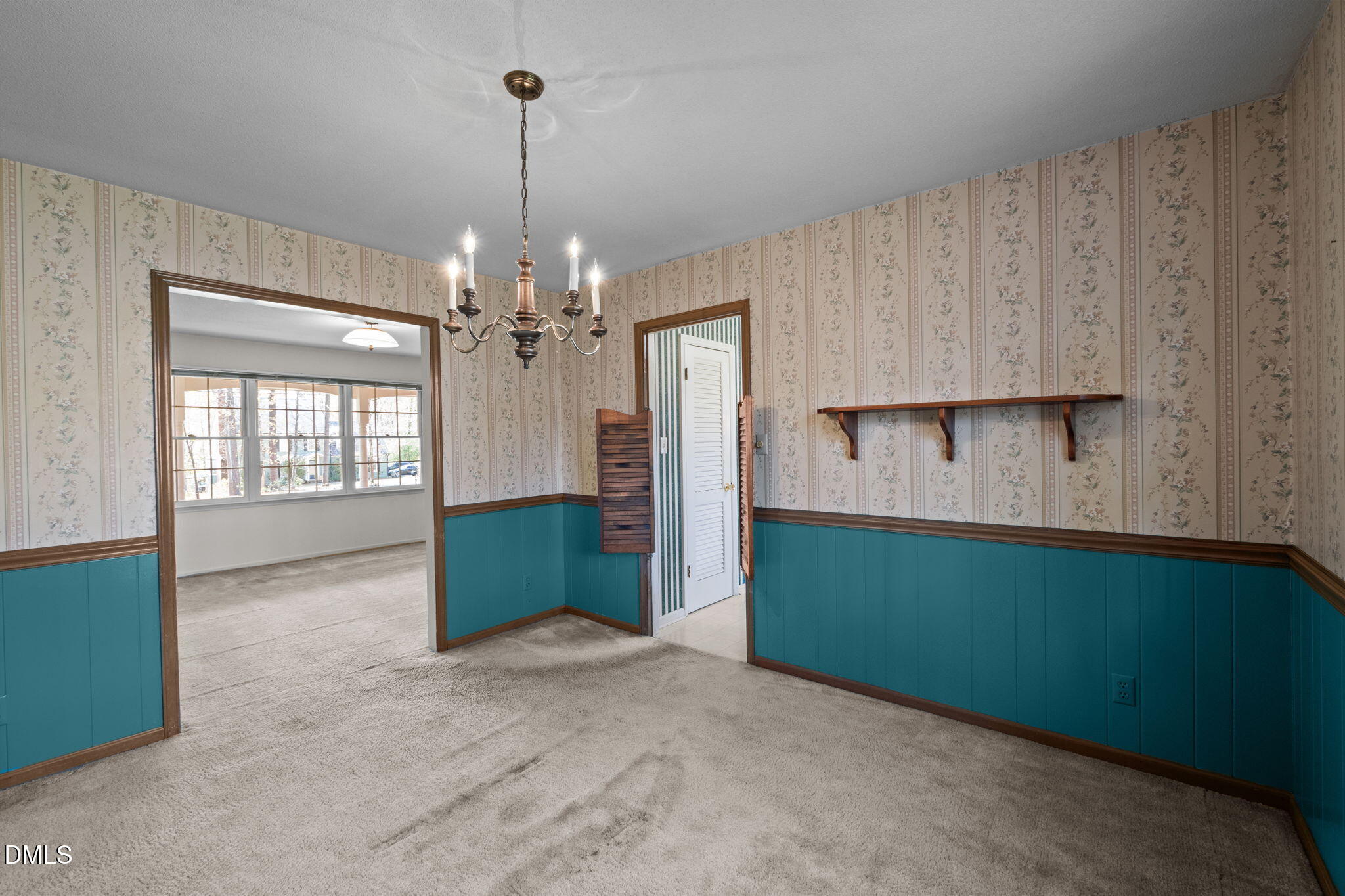 2421 Bonnie Brae Road Durham, NC 27703 - Photo 13 of 55 a view of a kitchen with cabinet and chandelier