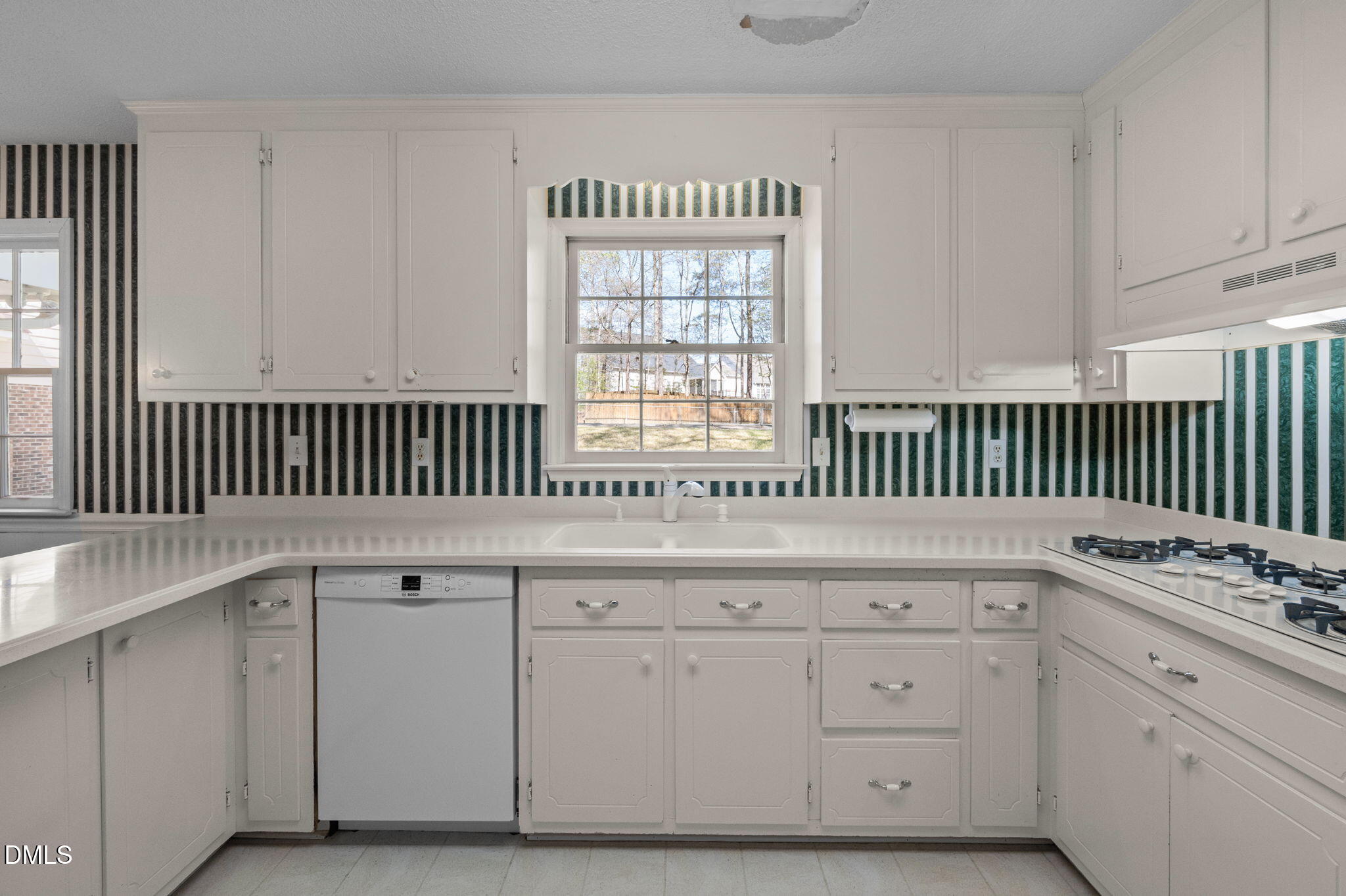 2421 Bonnie Brae Road Durham, NC 27703 - Photo 19 of 55 a view of cabinets with wooden floor