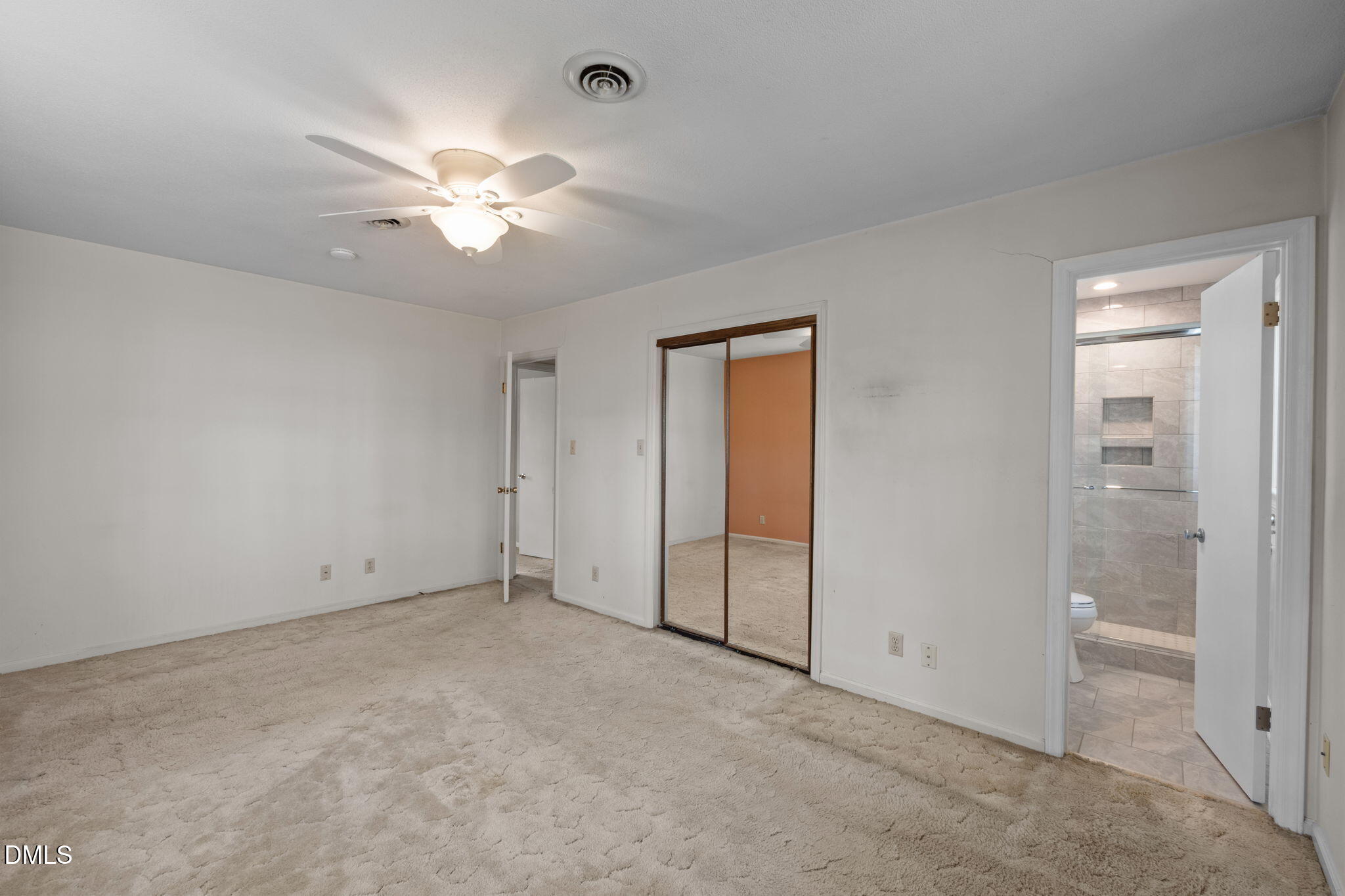 2421 Bonnie Brae Road Durham, NC 27703 - Photo 29 of 55 an empty room with closet and a chandelier fan