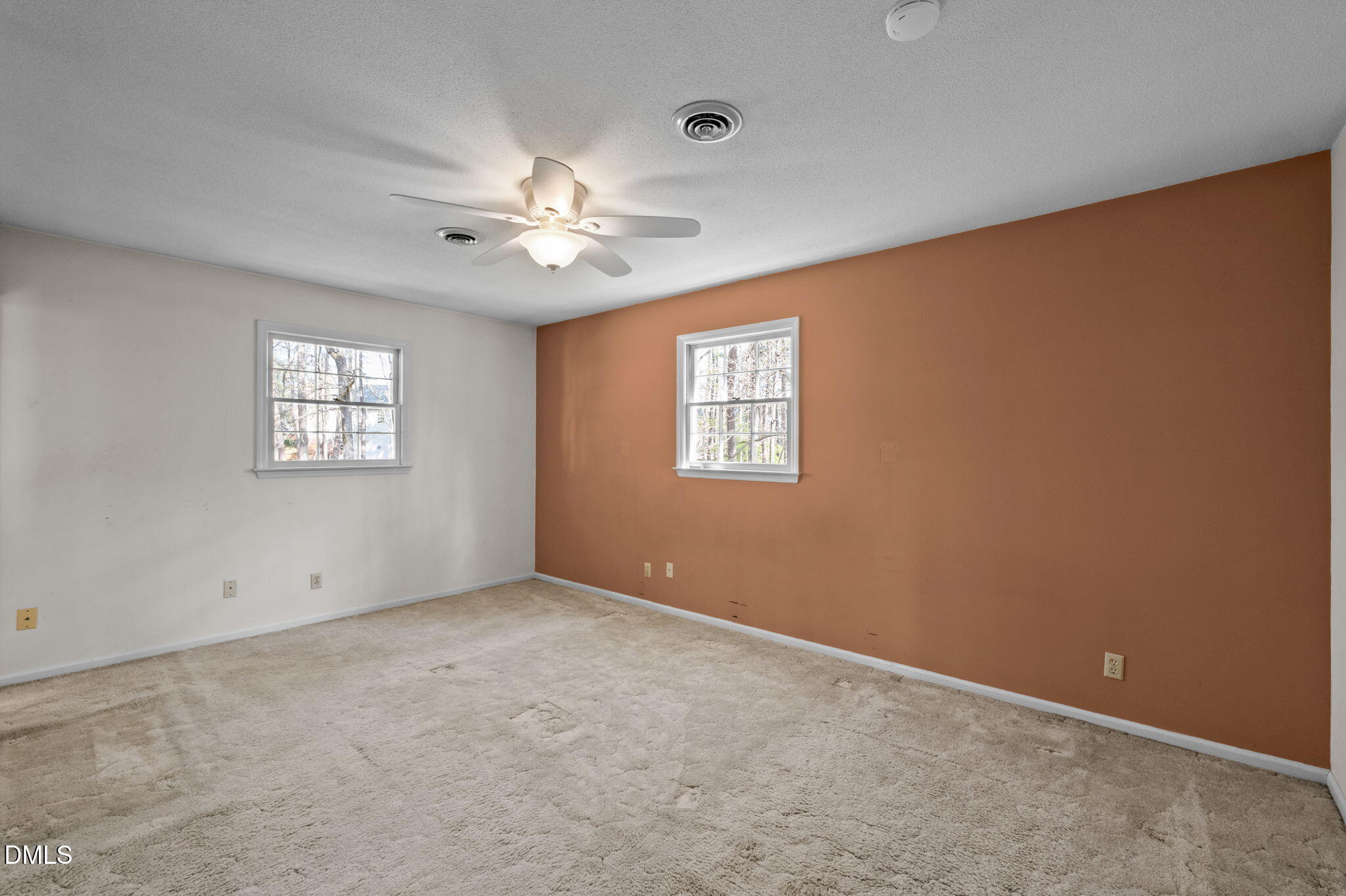 2421 Bonnie Brae Road Durham, NC 27703 - Photo 30 of 55 an empty room with windows and fan