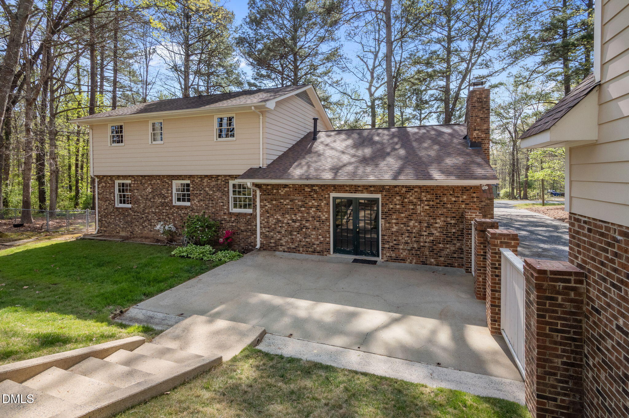 2421 Bonnie Brae Road Durham, NC 27703 - Photo 45 of 55 a front view of a house with a garden and trees