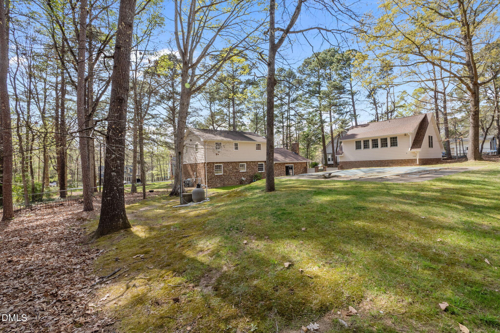 2421 Bonnie Brae Road Durham, NC 27703 - Photo 48 of 55 a view of a trees in front of a brick house