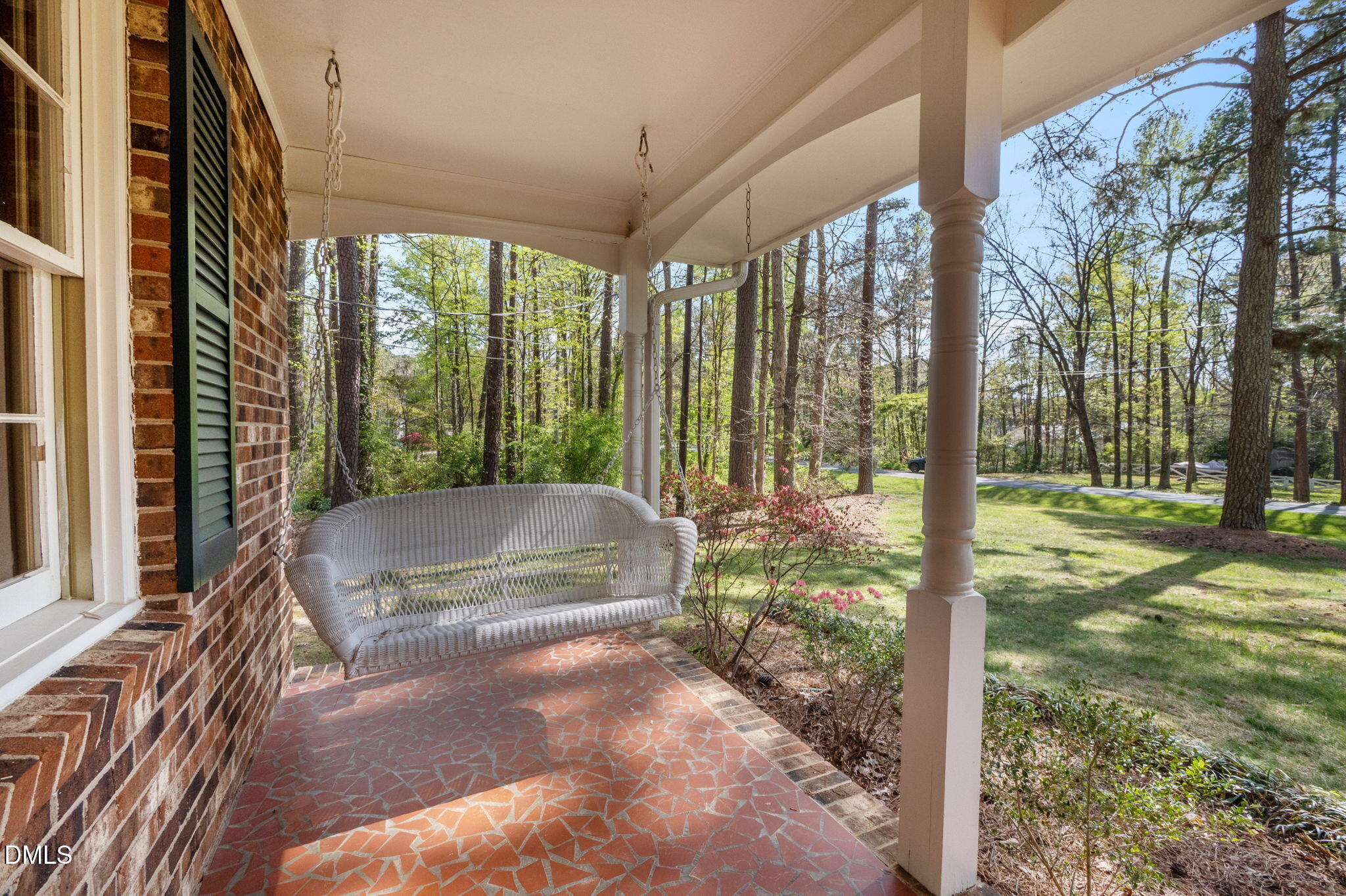 2421 Bonnie Brae Road Durham, NC 27703 - Photo 5 of 55 a view of a porch with a floor to ceiling window and a yard