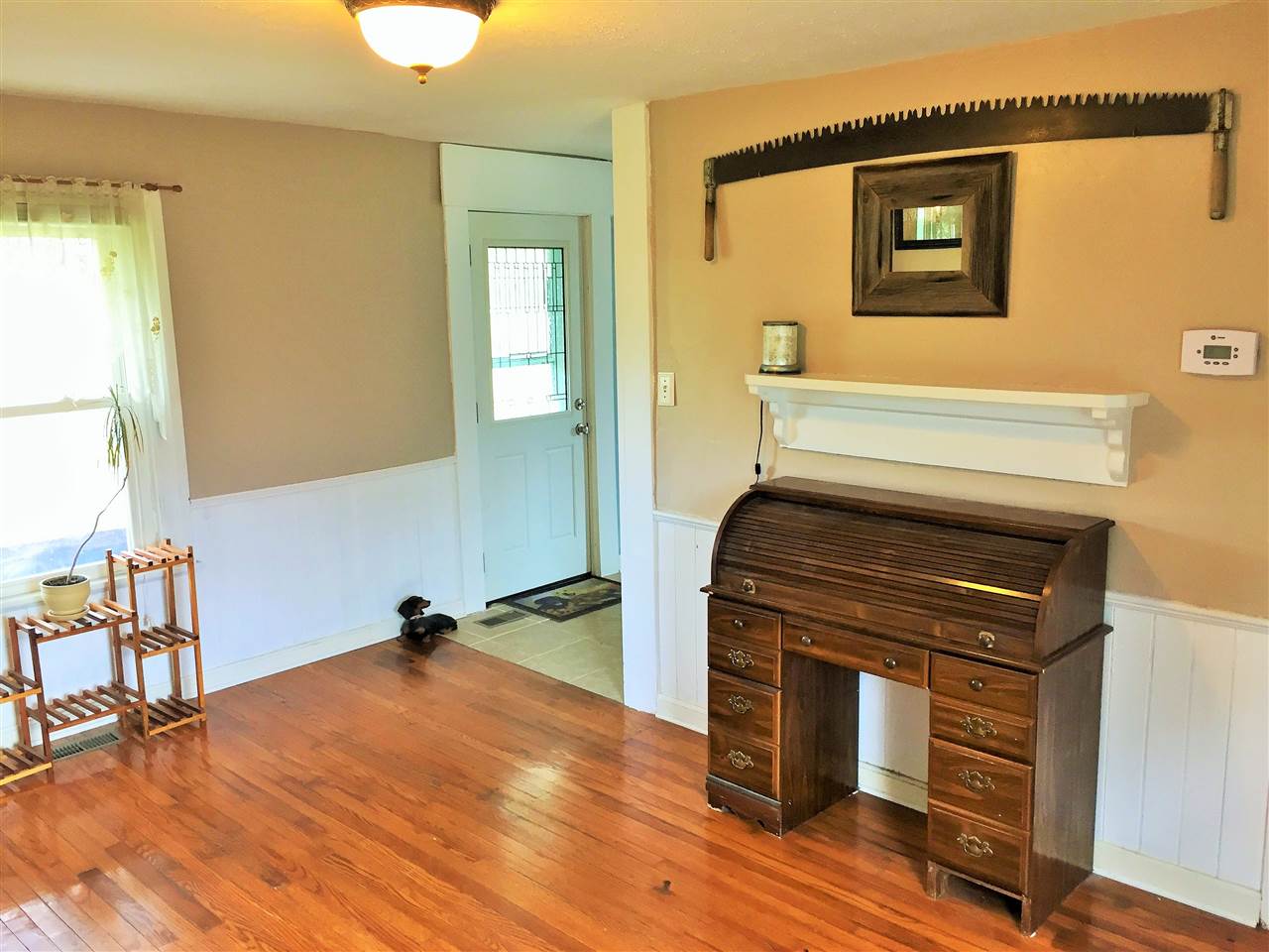 4274 Rockfish Road Grottoes, VA 24441 - Photo 24 of 41 a view of a livingroom with wooden floor and a fireplace