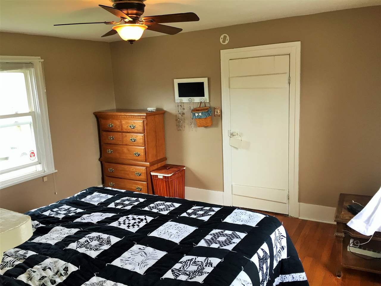 4274 Rockfish Road Grottoes, VA 24441 - Photo 31 of 41 a bedroom with a bed and wooden floor