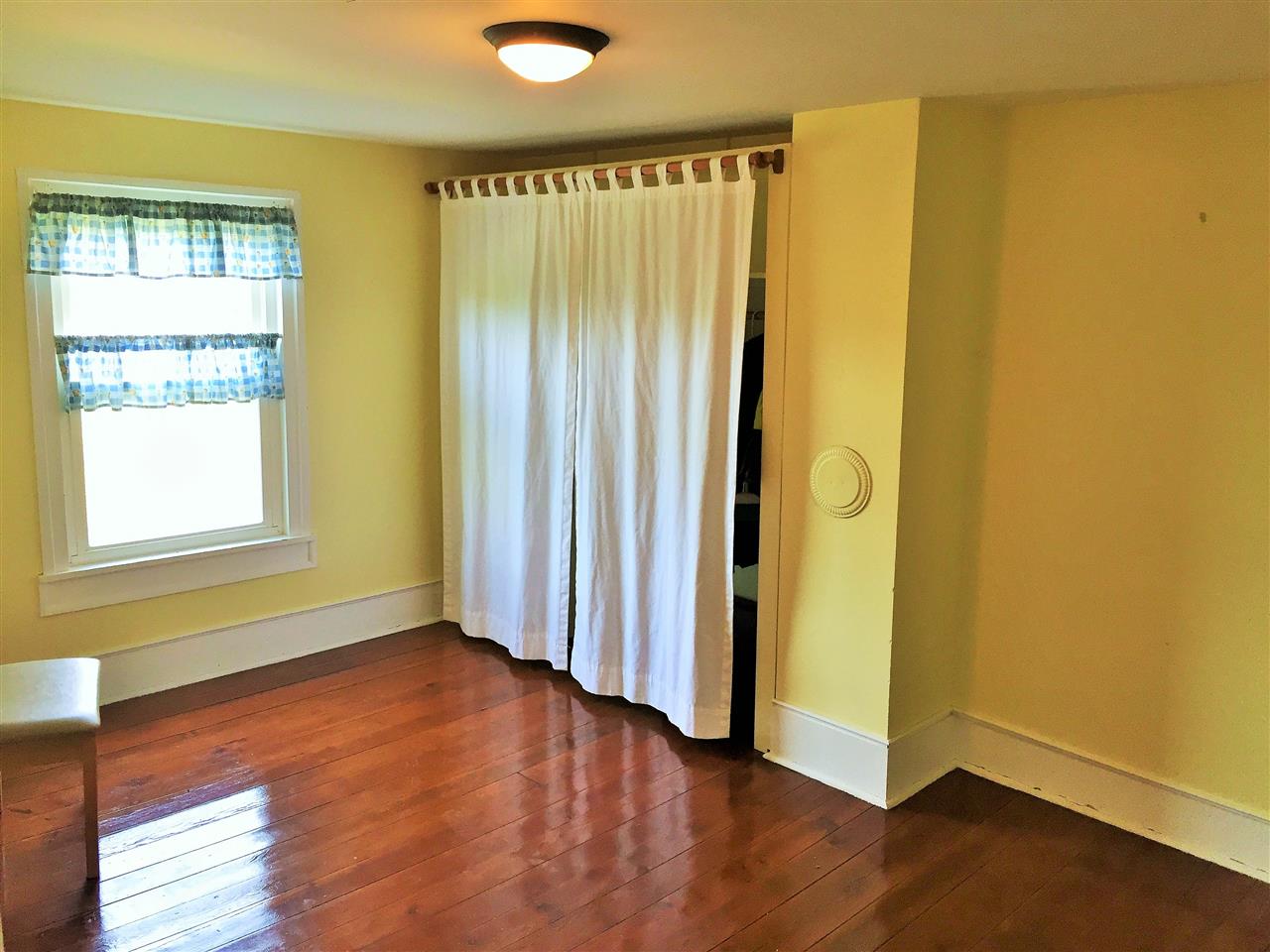 4274 Rockfish Road Grottoes, VA 24441 - Photo 35 of 41 a view of an empty room with wooden floor and a window