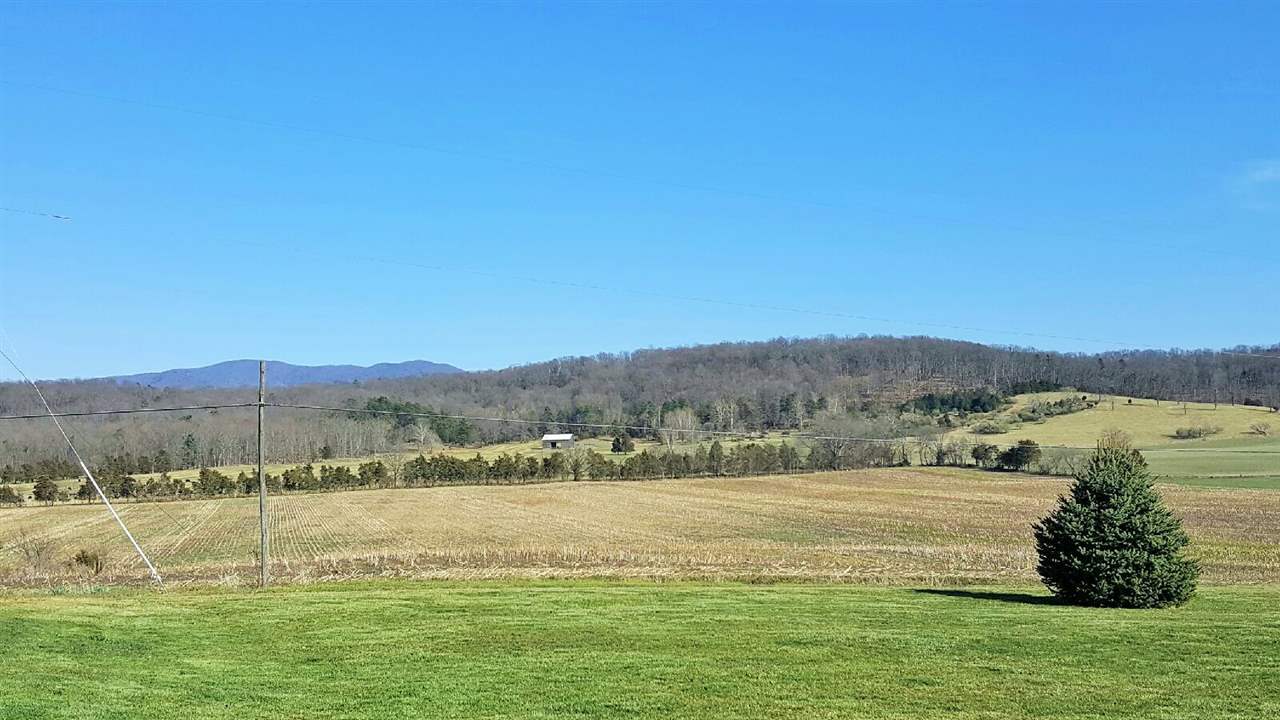 4274 Rockfish Road Grottoes, VA 24441 - Photo 8 of 41 a view of a lake with a mountain
