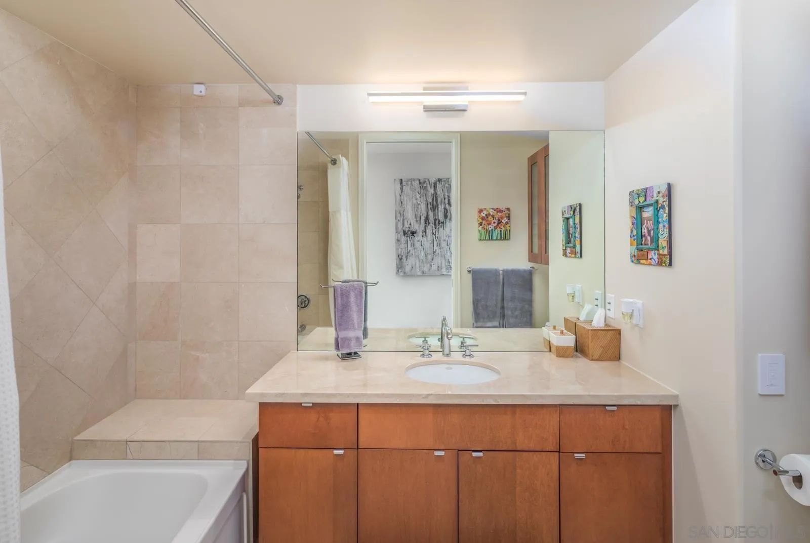 550 Front Street, Unit 1908 San Diego, CA 92101 - Photo 14 of 27 a bathroom with a sink and a mirror
