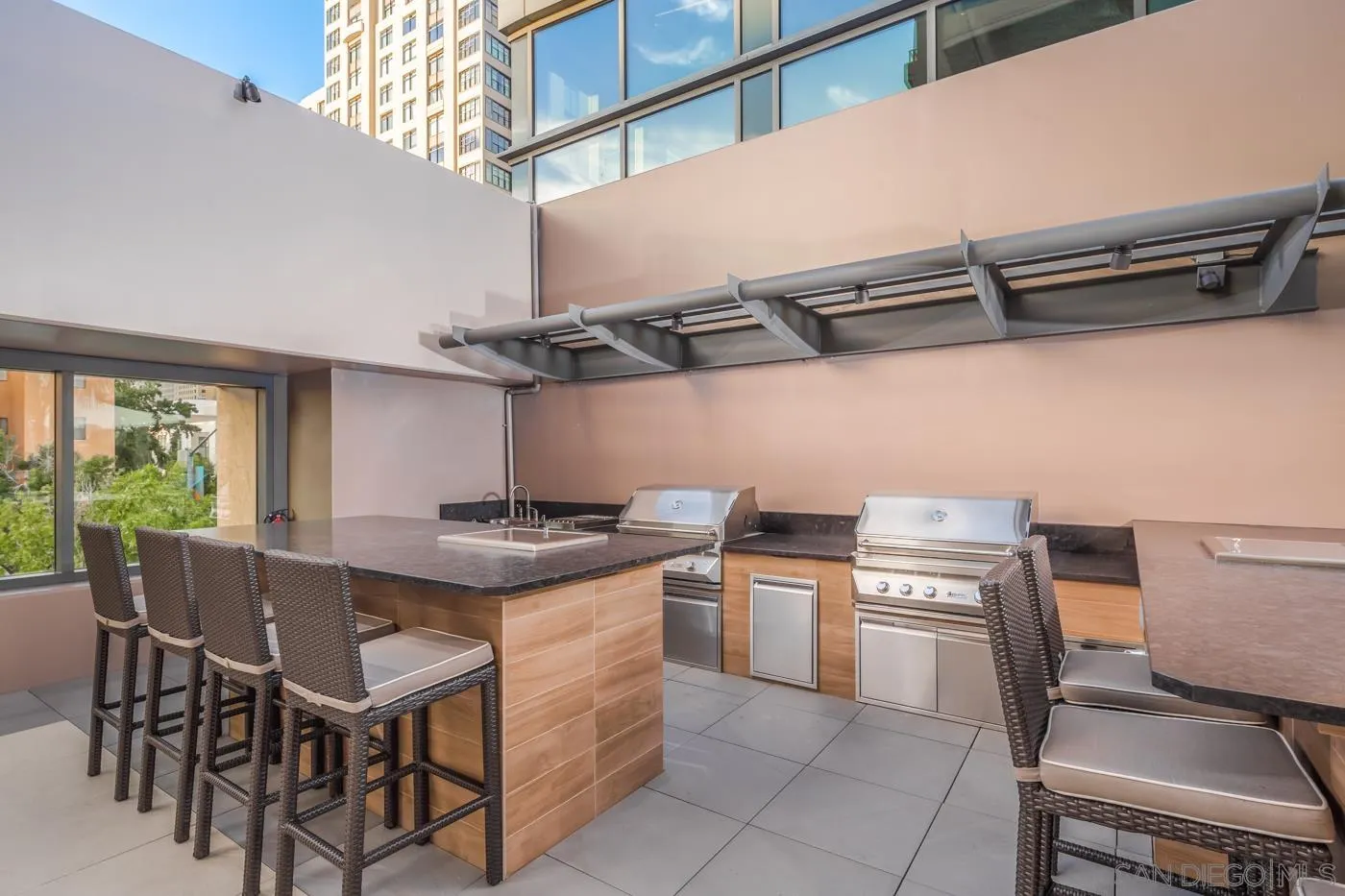 550 Front Street, Unit 1908 San Diego, CA 92101 - Photo 23 of 27 a kitchen with stainless steel appliances granite countertop a stove a sink and a refrigerator