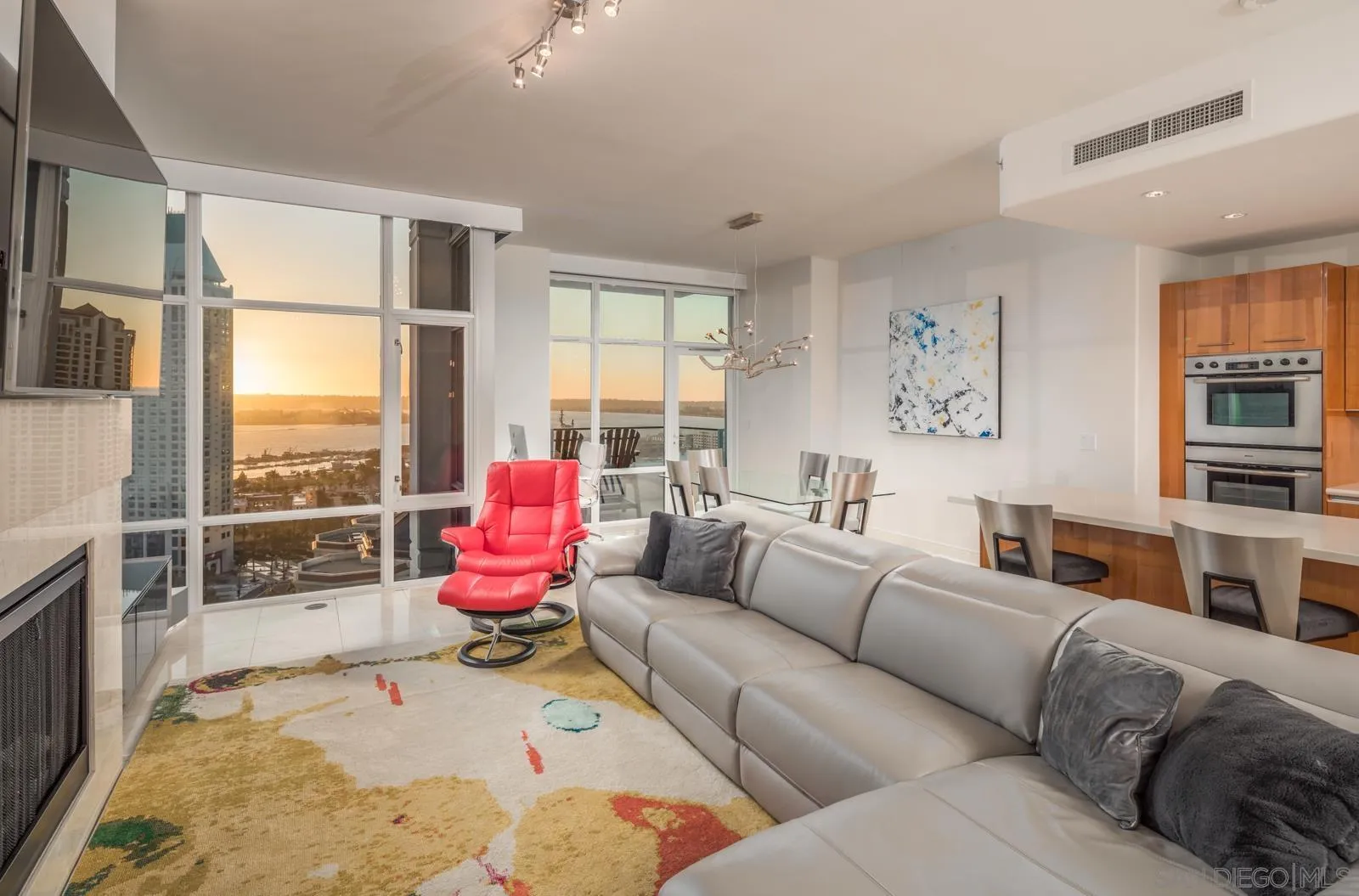 550 Front Street, Unit 1908 San Diego, CA 92101 - Photo 5 of 27 a living room with furniture toys and a large window