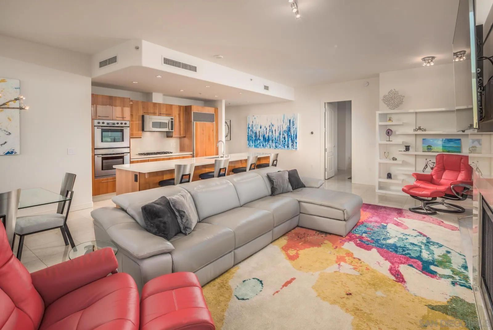 550 Front Street, Unit 1908 San Diego, CA 92101 - Photo 7 of 27 a living room with furniture fireplace and flat screen tv