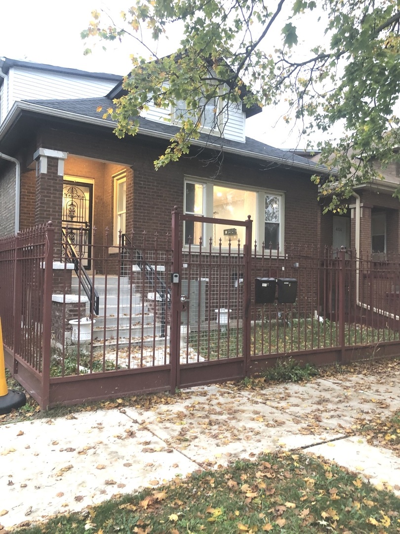 4858 West Concord Place, Unit 1 Chicago, IL 60639 - Photo 14 of 14 a view of a house with a backyard