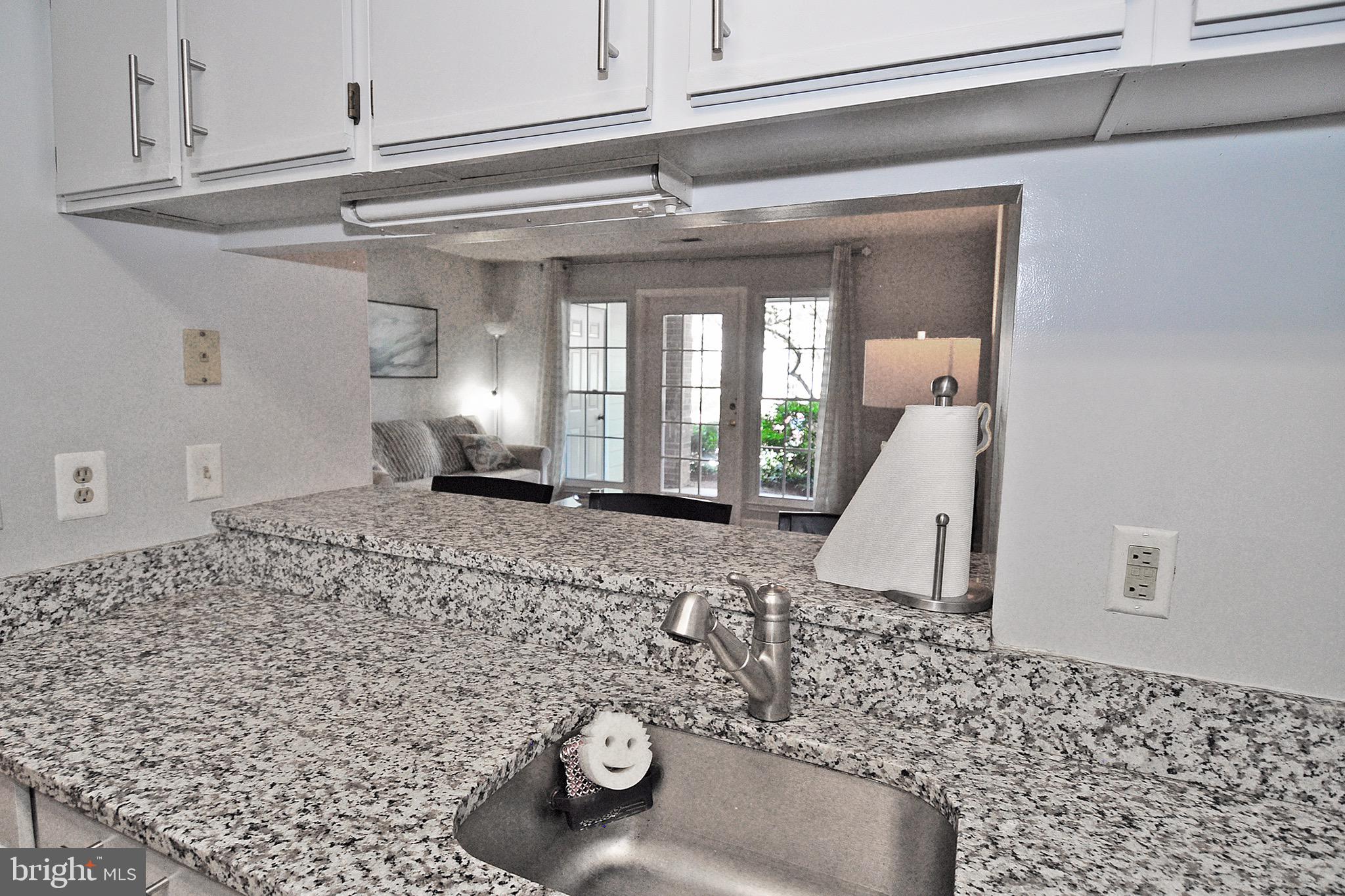 20963 Timber Ridge Terrace, Unit 101 Ashburn, VA 20147 - Photo 11 of 26 Kitchen Area Overlooks Living Room