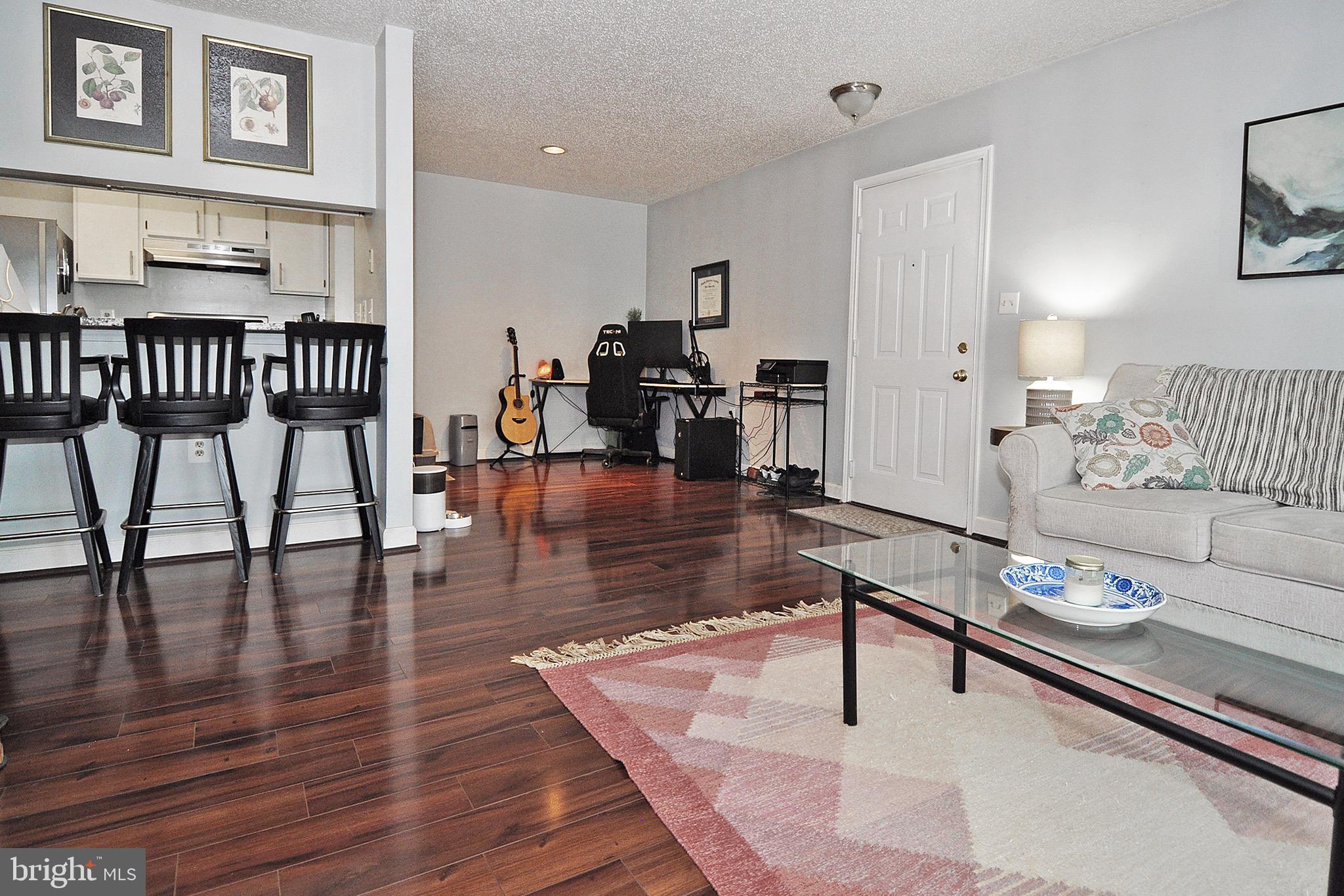 20963 Timber Ridge Terrace, Unit 101 Ashburn, VA 20147 - Photo 4 of 26 Living Room and Dining Area