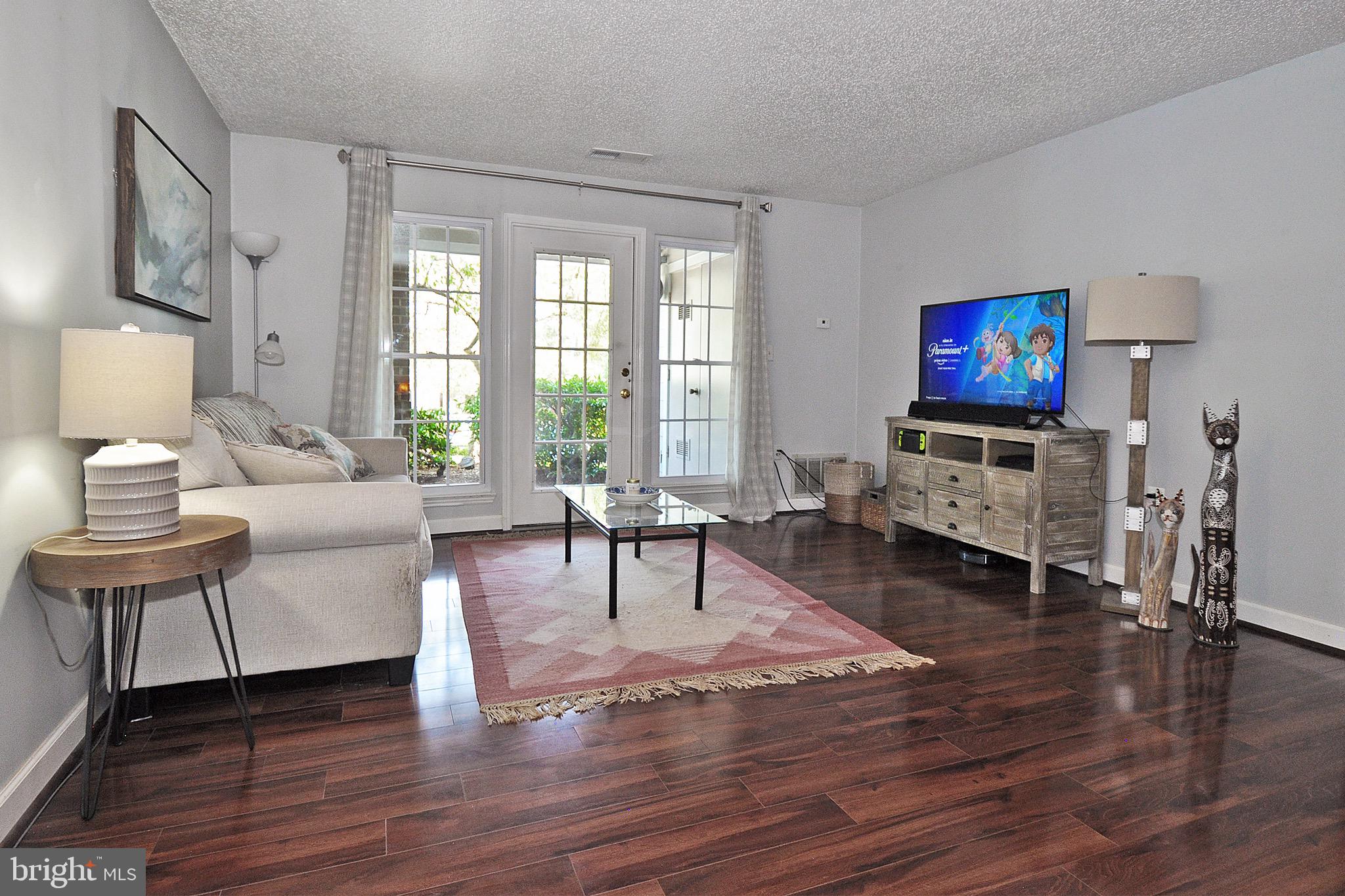 20963 Timber Ridge Terrace, Unit 101 Ashburn, VA 20147 - Photo 5 of 26 Beautiful Hardwoods Throughout