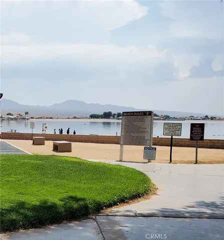 a swimming pool with outdoor seating and yard